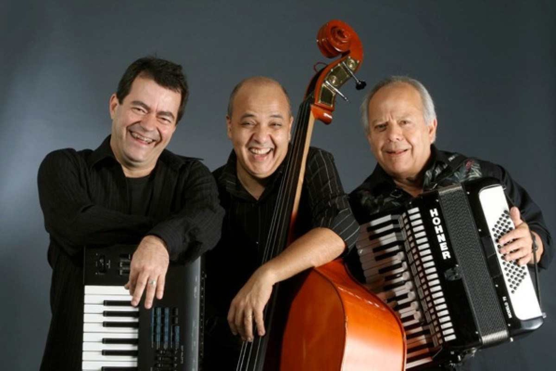 Músicos Clóvis Aguiar, Milton Ramos e Célio Balona 