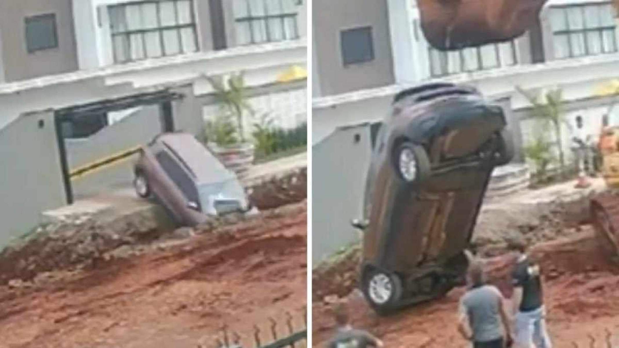 Carro cai em buraco de obra ao sair da garagem