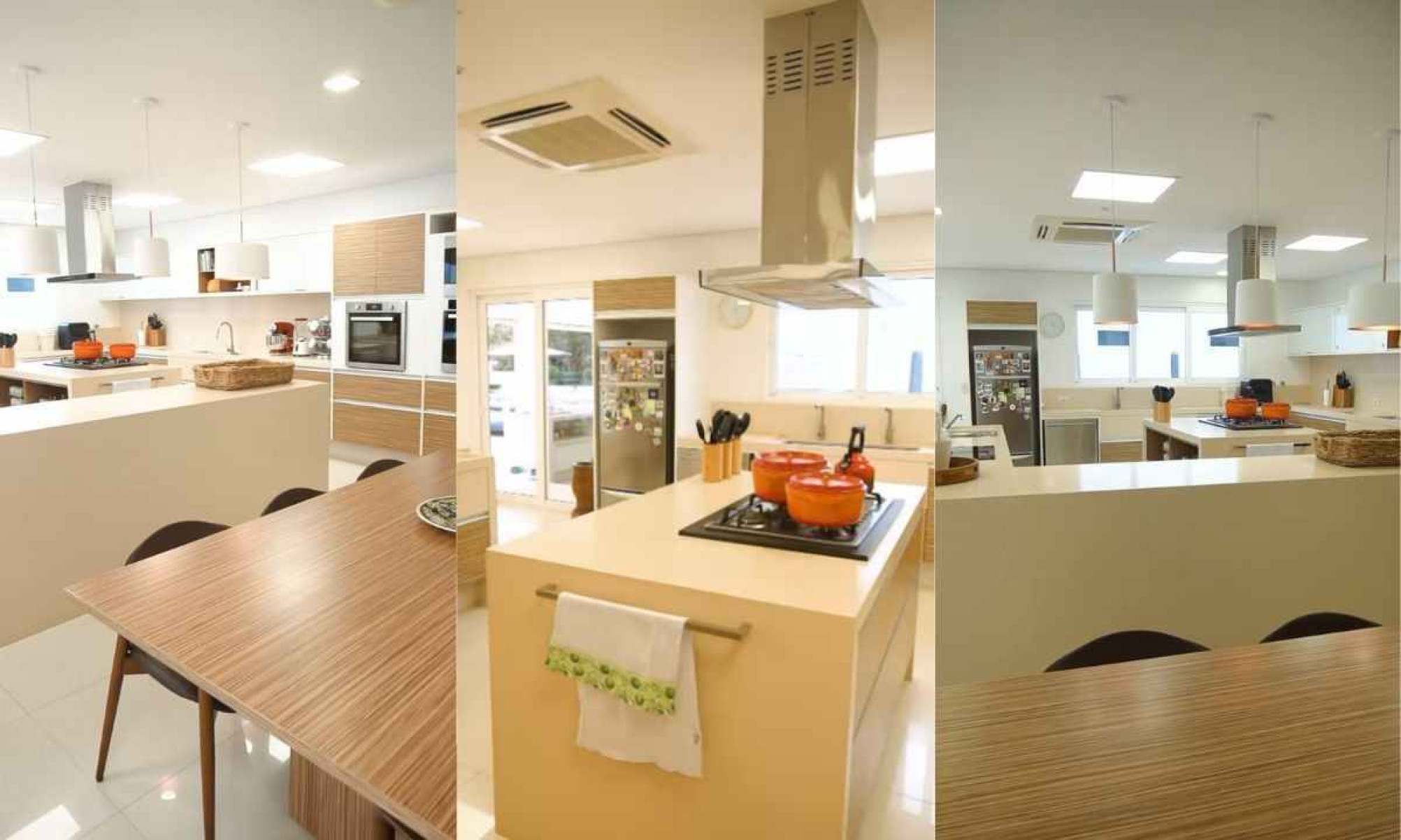 Ampla cozinha de 120 m² que inclui uma ilha central, ideal para grandes preparos culinário