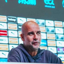 Pep Guardiola com uma de suas filhas -  (crédito: Foto: Oli Scarff/AFP via Getty Images)