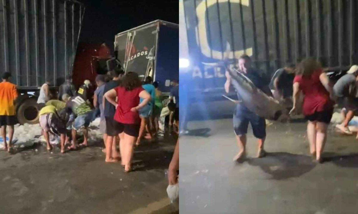 População briga para conseguir mercadoria liberada depois de acidente na Via Expressa, em Contagem, na noite dessa quinta (19) -  (crédito: Reprodução/Redes sociais)