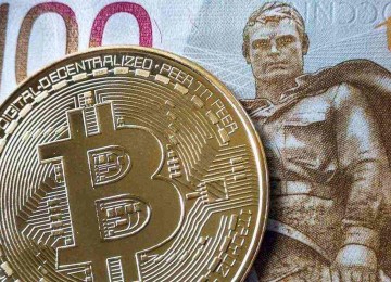 Bitcoin, principal moeda virtual do mundo, alcançou um novo recorde, superando a marca dos US$ 80 mil -  (crédito: Alexander NEMENOV / AFP)