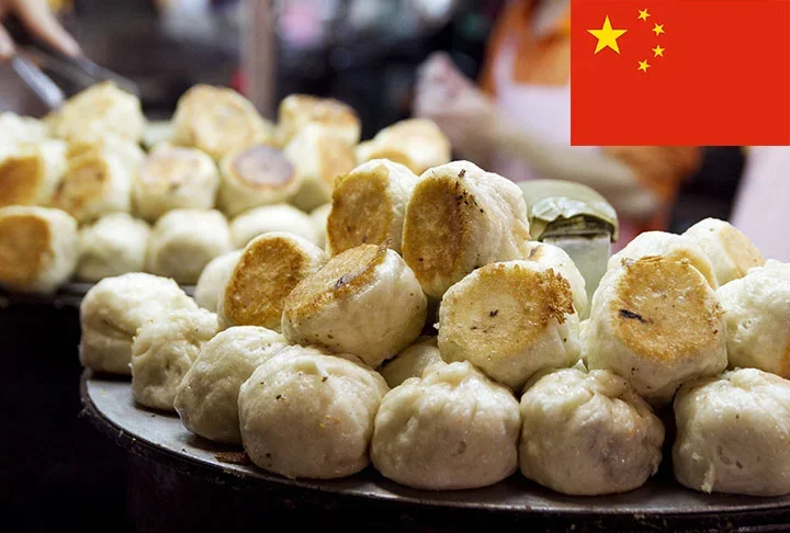 12º lugar - Shengian Mantou (China) - Baozi (pão cozido no vapor), pequeno e frito, recheado com carne de porco e gelatina que derrete formando uma sopa quando cozido.-Flickr Robyn Lee