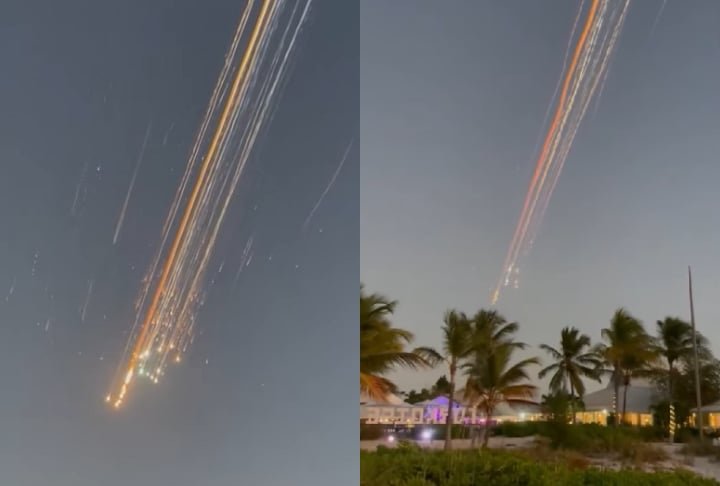 Imagens captadas pela Agência de Notícias Reuters mostram bolas de luz laranja deixando rastros de fumaça no céu de Porto Príncipe, no Haiti.