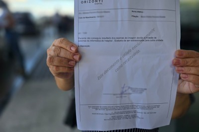 Paciente recebeu documento afirmando que não conseguiu acesso a resultado de exame devido a ataque no sistema do hospital -  (crédito: Leandro Couri/E.M./D.A. Press)
