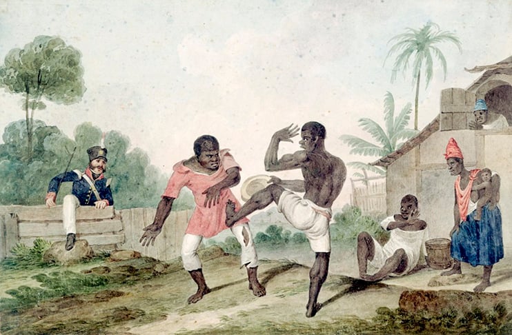 A capoeira tem origem na cultura trazida por povos negros escravizados. Trata-se de uma dança e luta ritmada, cujo os movimentos realizados durante uma roda são acompanhados pelo som do berimbau, cantos e palmas.-Augustus Earle domínio público