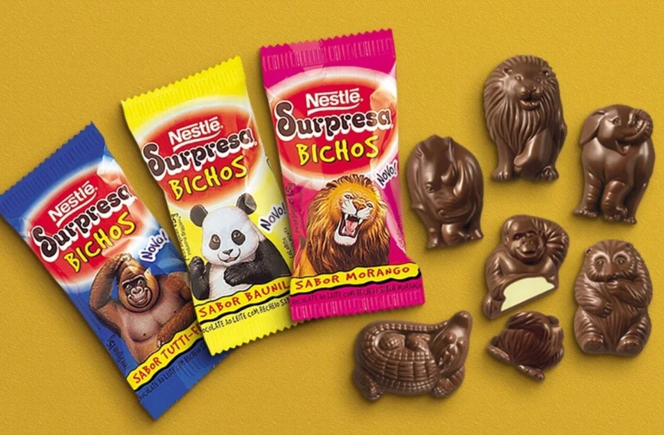 Surpresa Bichos: Embalada no sucesso do Chocolate Surpresa, a Nestlé lançou a linha "Surpresa Bichos", em 1997. Essa era uma versão menor, com o formato dos bichinhos e sem cartão de curiosidades.