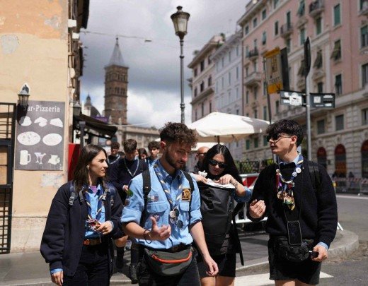  Scouts walk on a road crossing with Santa Maria Maggiore basilica in the background, where the Pope is set to be buried, a day prior to the Pope's funeral, in Rome on April 25, 2025. The Vatican on April 25, 2025, said over 128,000 people have already paid their respects to Pope Francis, whose body is lying in state in St Peter's Basilica ahead of his funeral set for April 26, 2025. (Photo by Dimitar DILKOFF / AFP)
      