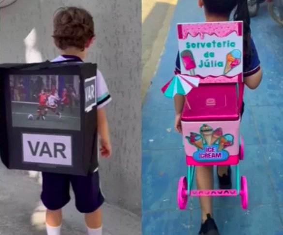 Chama o VAR: Enquanto a Júlia tem sua própria sorveteria nas costas, esse outro pequeno levou simplesmente uma mochila em forma de cabine de VAR (árbitro de vídeo dos jogos de futebol).