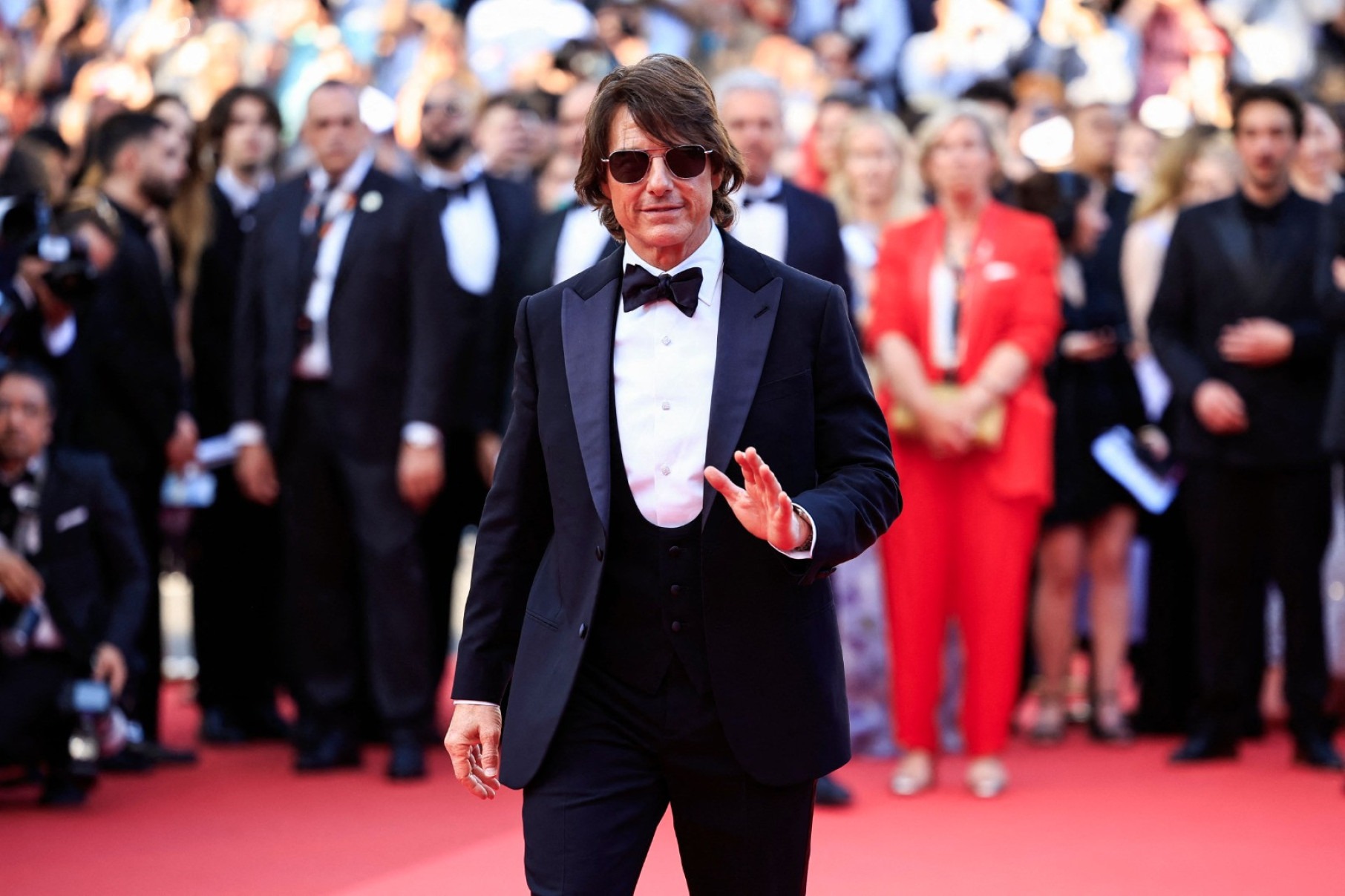 Tom Cruise combinou gravata borboleta com franjinha para a exibição do novo filme de "Missão: Impossível"-Valery Hache/AFP