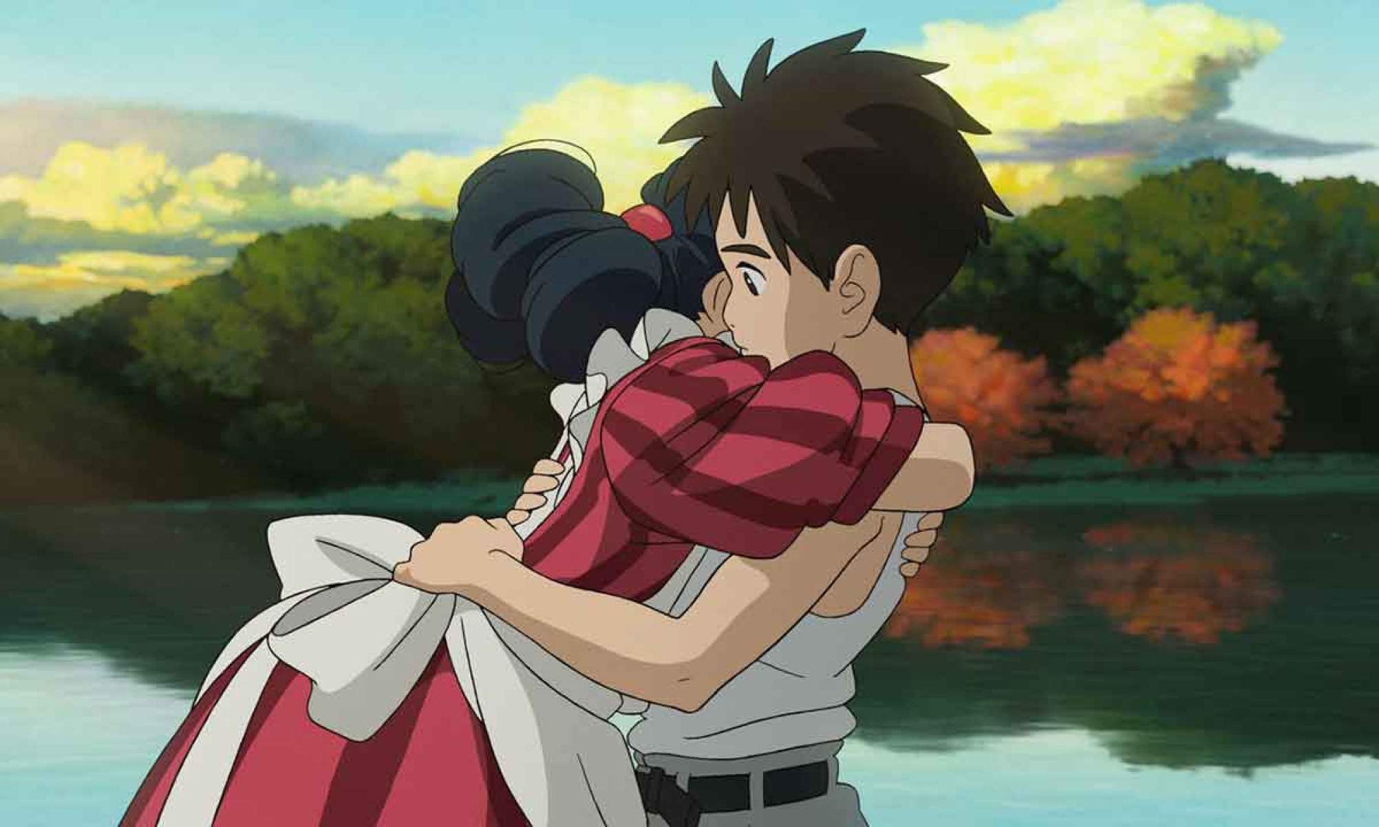 "O menino e a garça" (2024) foi anunciado como o último filme de Hayao Miyazaki, que fundou o estúdio com Isao Takahata O menino é abraçado por mulher em cena de O menino e a garça