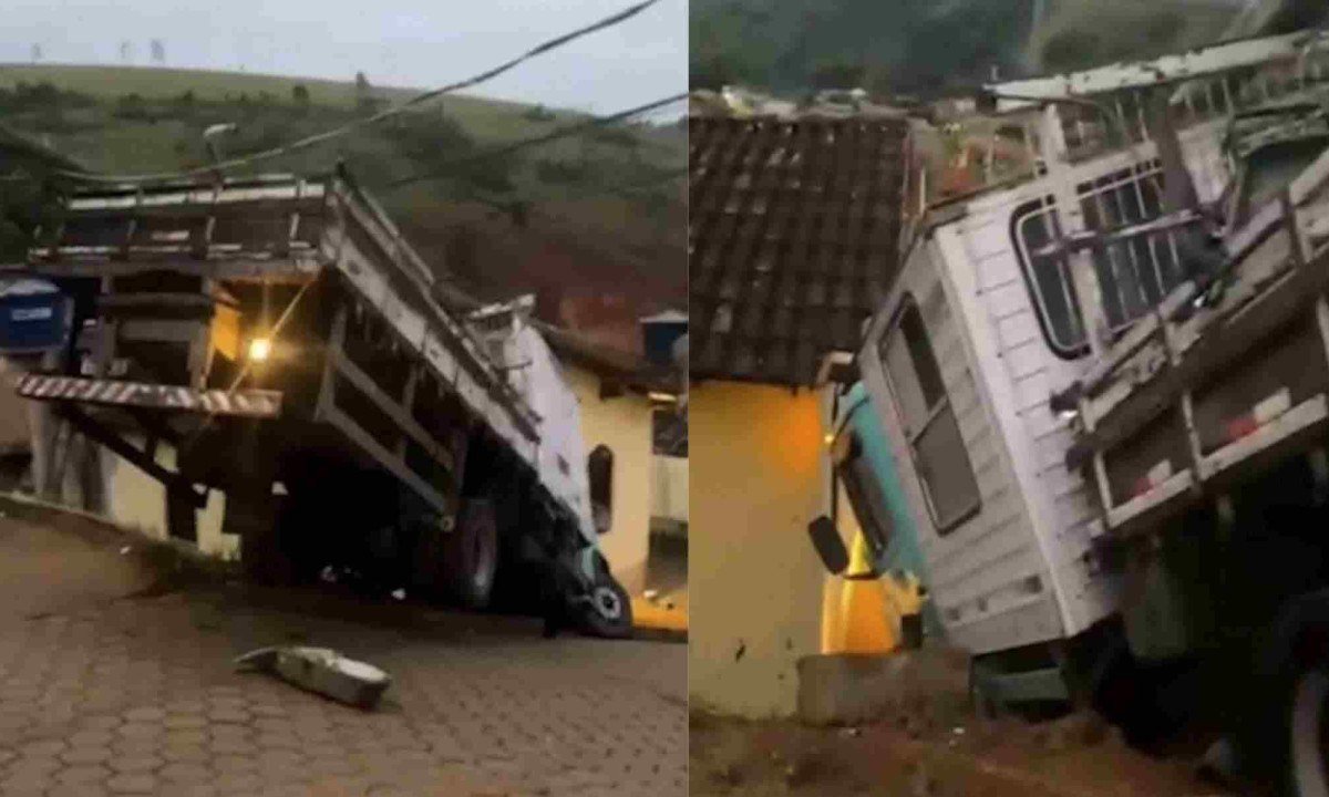 Caminhão perdeu os freios e ficou suspenso em um barranco entre a rua e uma residência -  (crédito: PMMG/Divulgação)