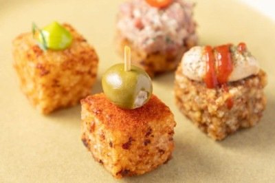 Quatro versões assinadas por chefs do dadinho de tapioca foram lançadas em comemoração aos 20 anos do icônico petisco  -  (crédito: Ricardo Dangelo/Divulgação )