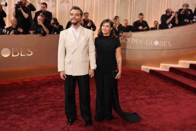 Wagner Moura e a mulher, Sandra Delgado, no tapete vermelho do Globo de Ouro de 2026 -  (crédito: Golden Globes)