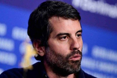 O paulista Adolpho Veloso diz que s&oacute; n&atilde;o abra&ccedil;a criancinhas, como fazem os pol&iacute;ticos, na campanha em busca de votos para o Oscar de Melhor Fotografia -  (crédito: John Macdougall/AFP)