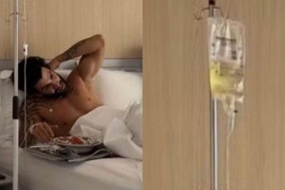Gusttavo Lima choca fãs ao aparecer acamado com soro assistindo ao jogo da Copa -  (crédito: Tupi)