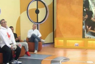 Craque Neto ‘imita’ Virginia e senta no colo de jornalista ao vivo na Band; assista -  (crédito: Tupi)