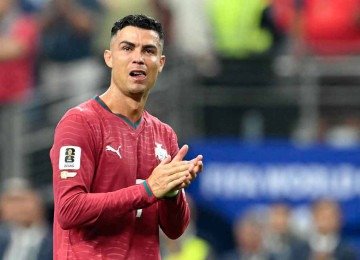 Cristiano Ronaldo reúne cerca de 670 milhões de seguidores no Instagram, atraindo um público focado em alta performance e marcas de luxo -  (crédito: RONALDO SCHEMIDT / AFP)