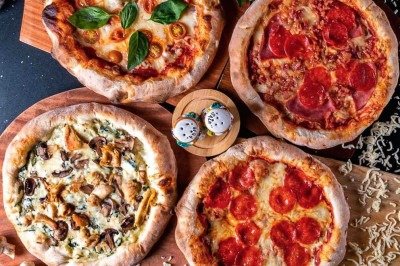 As tradicionais pizzas fazem parte do cardápio da Italianíssima, festa na Praça da Filarmônica -  (crédito: Instagram/Reprodução)