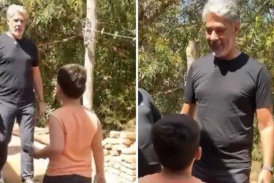 William Bonner durante grava&ccedil;&atilde;o em Joan&eacute;sia, no Vale do Rio Doce, interage com o menino Murilo em momento que viralizou nas redes. -  (crédito: Redes sociais)