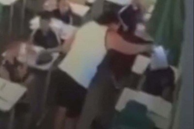 Imagem da c&acirc;mera de seguran&ccedil;a que mostra o momento em que a professora esfrega a prova no rosto do seu aluno n Escola Estadual Celmar Botelho Duarte, no Bairro Provid&ecirc;ncia, na Regi&atilde;o Norte de Belo Horizonte  -  (crédito: Reprodu&ccedil;&atilde;o/Redes Sociais)