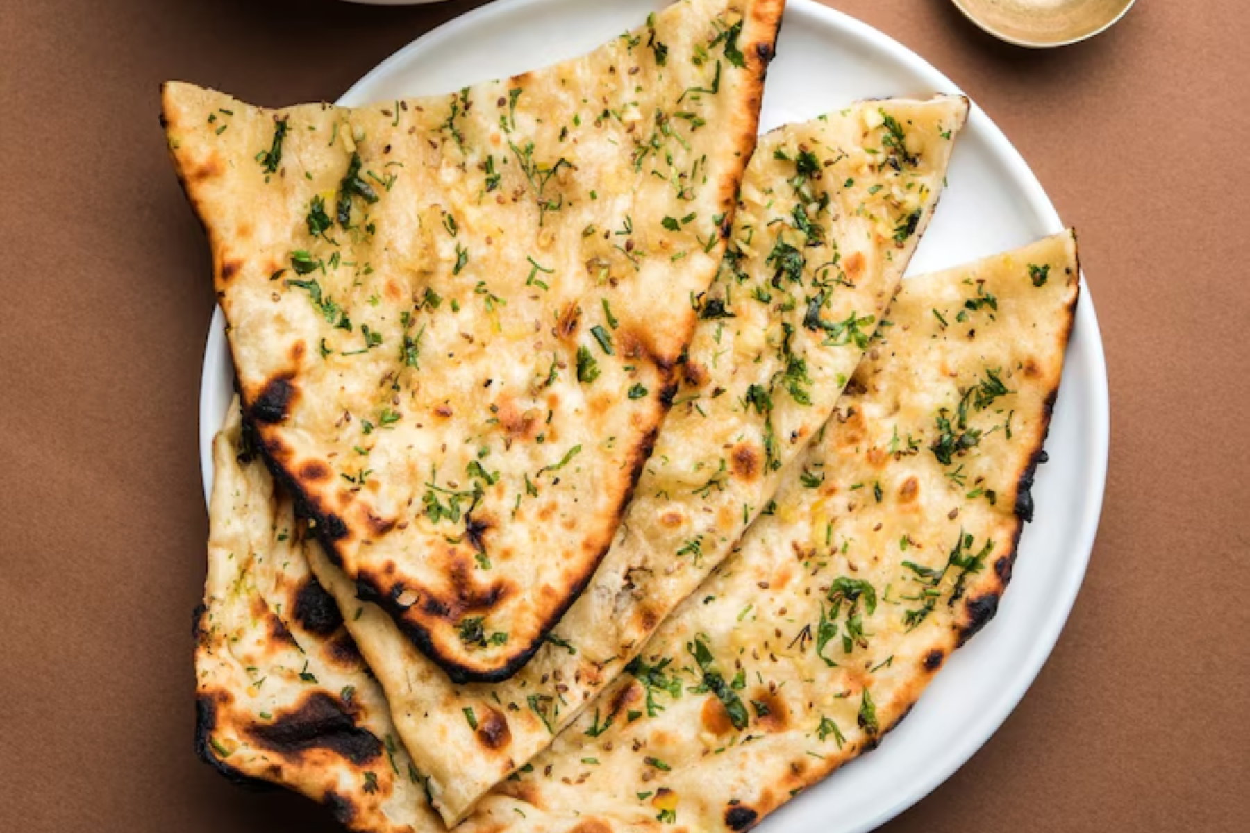3º Amritsari Kulcha da Índia (Nota: 4.7) -  Originário de Amritsar, é um pão recheado com batatas, cebolas, queijo e especiarias. Fino, crocante e cheio de sabor.