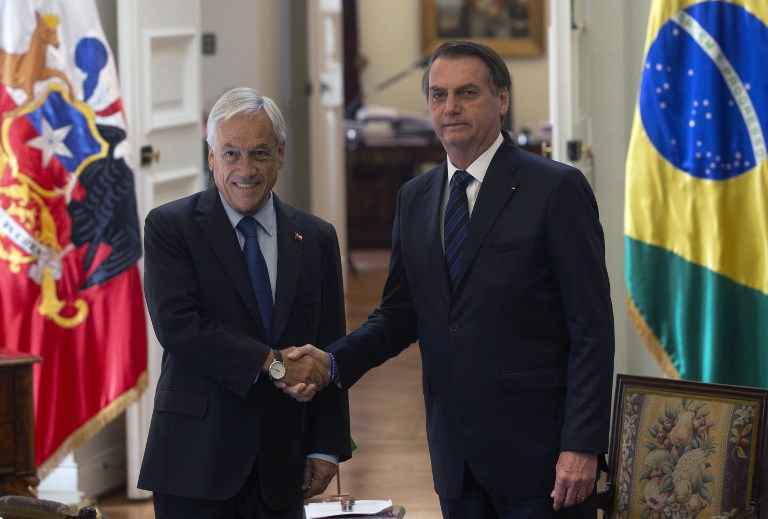 Bolsonaro critica lei trabalhista e diz que Brasil deve beirar a informalidade - Claudio Reyes/ AFP