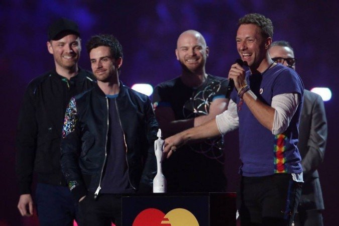 Coldplay retorna aos palcos em 2022 com turnê sustentável e shows no Brasil - JUSTIN TALLIS/AFP
